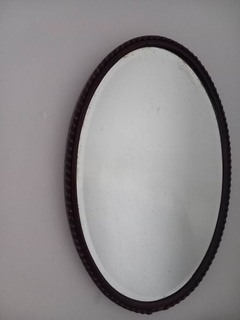 Oval Mirror with Dark Wood Frame and Rope-Twist Design