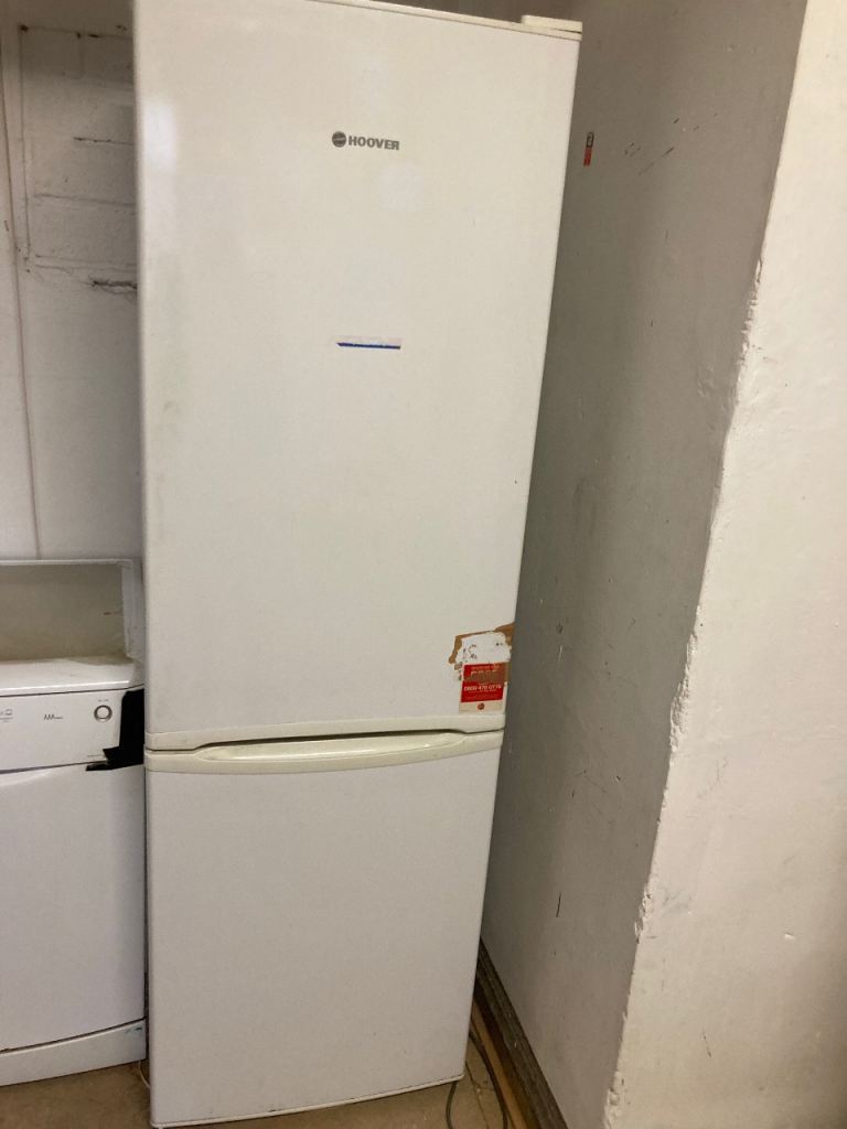 Freestanding fridge freezer in well used condition