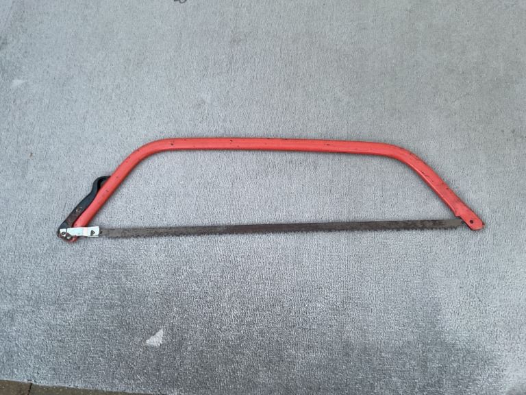 Bow saw with metal blade 