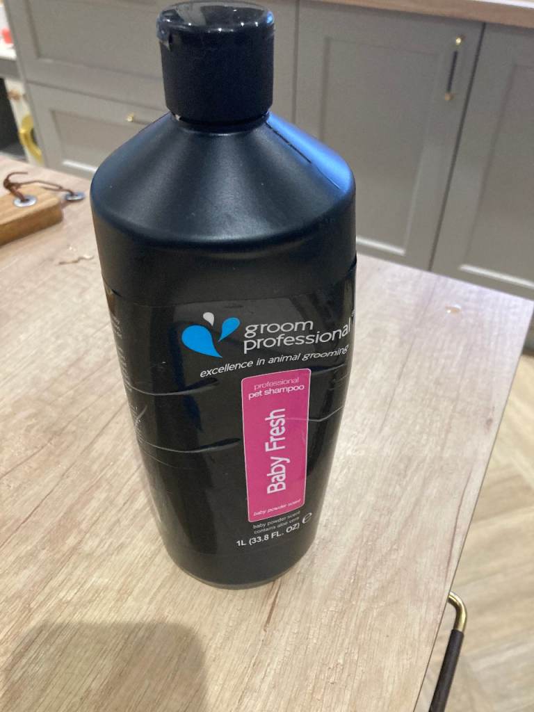 Half a 1lt bottle of Groom Professional Dog Shampoo