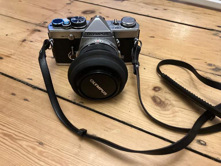 Olympus OM-2N 35mm SLR Camera with two lenses and case