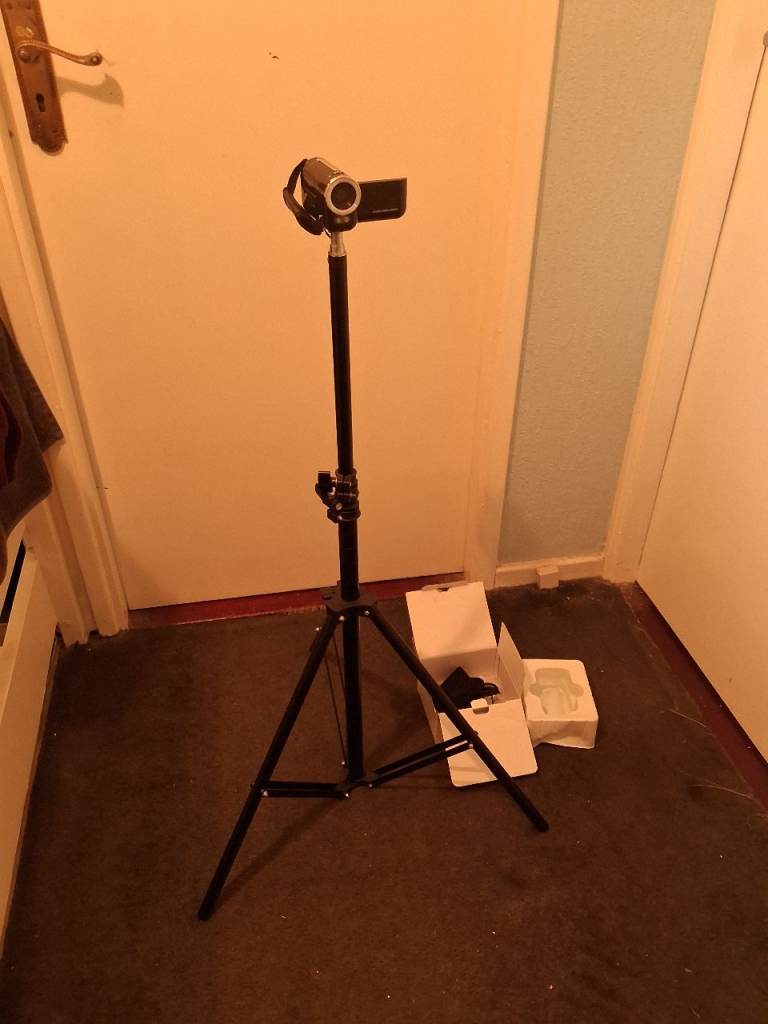 Brand new digital camera recorder with the box and manual and tripod stand
