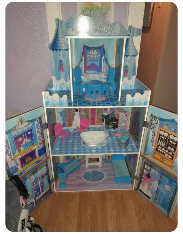 Wooden dolls house and peppa pig