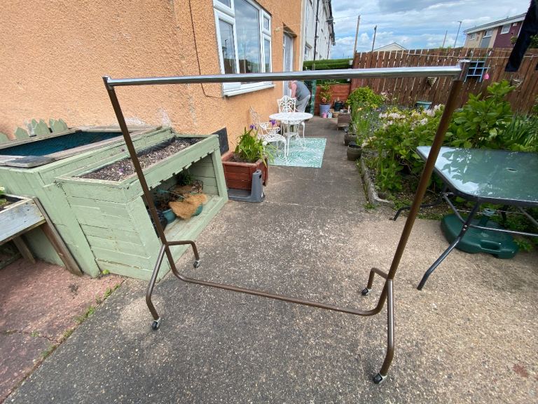Solid metal clothes rail on casters 
