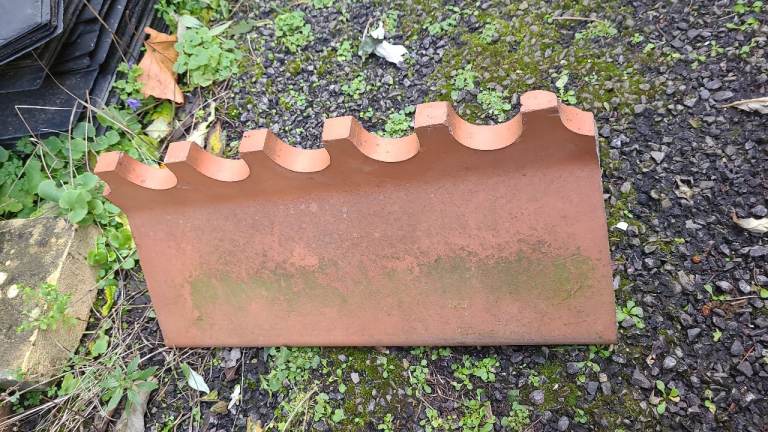 Clay scolluped ridge tiles