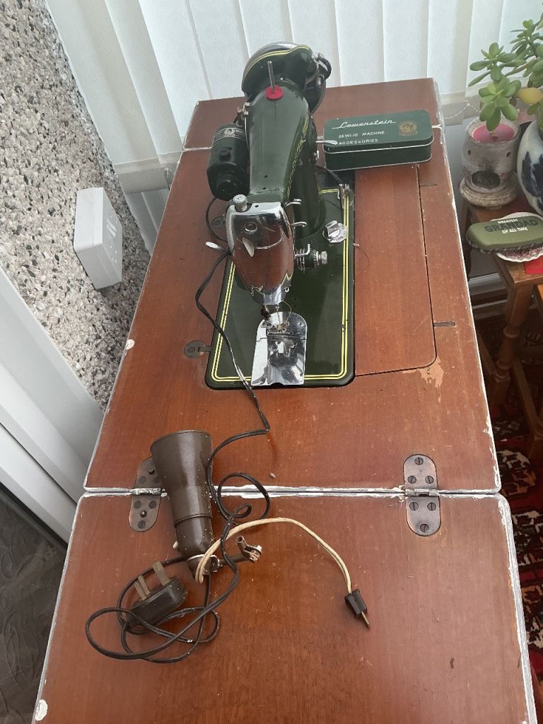 Antique Lewenstein sewing machine and table 