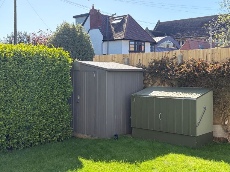 Two metal garden sheds