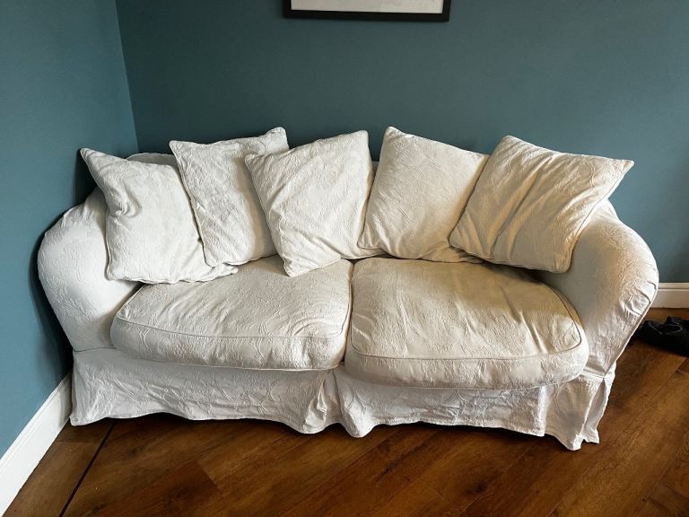 Three seater sofa with washable ivory upholstery 
