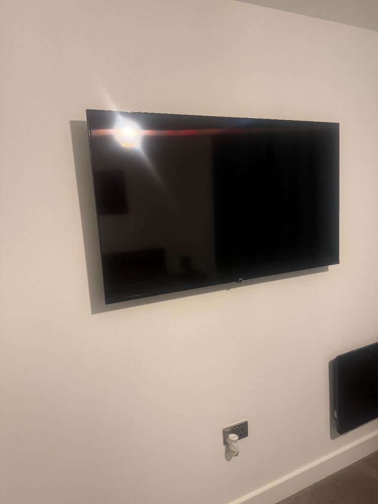 2 55' JVC Tvs and one tv stand- used for less than a year.