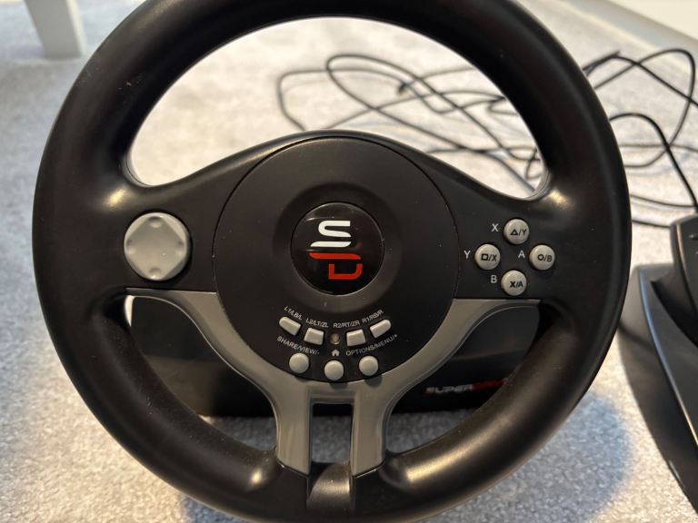 Steering wheel and pedal for games console