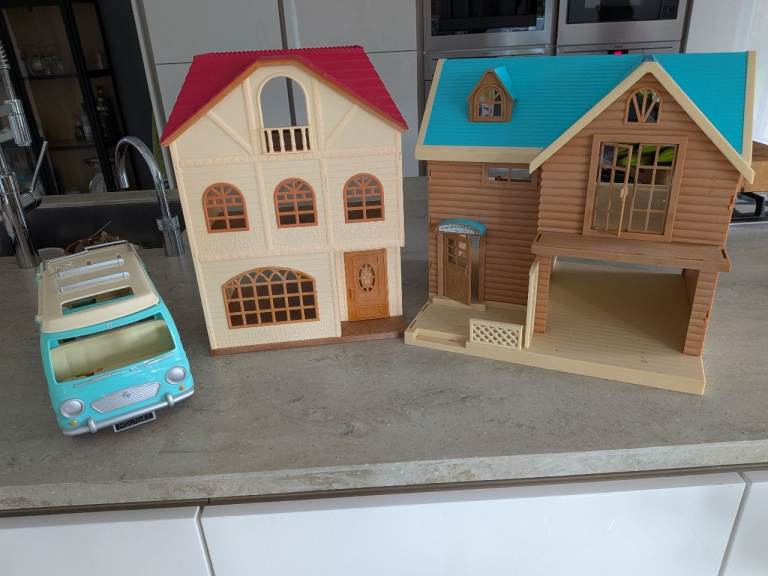 Two Sylvanian houses and camper van 