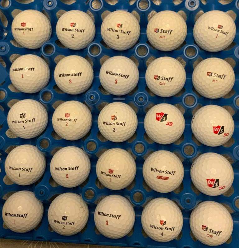 25 used Wilson Staff golf balls