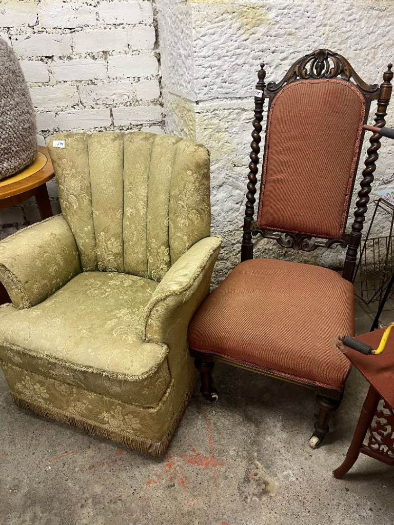 Antique Low Hall Chair , lovely carved detail , on castor wheels.