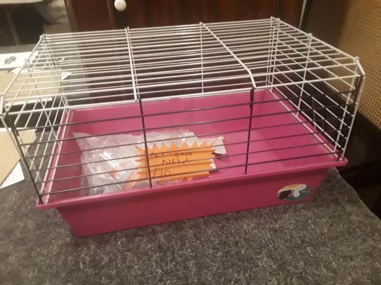 PET CAGE,  NEW. COMES WITH FEEDER AND WATER BOTTLE,  NEW 