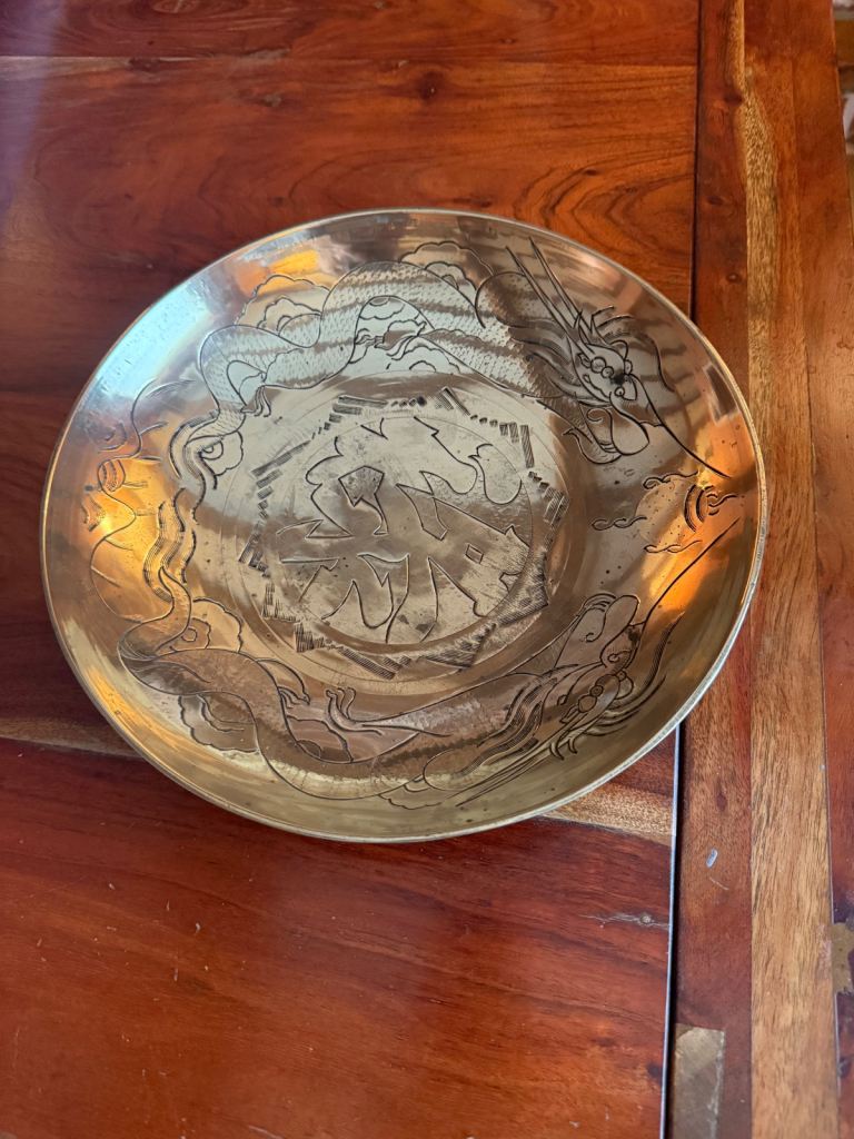 a vintage Chinese brass bowl.