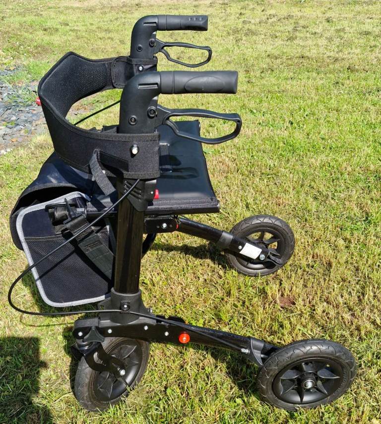 Rollator Walker with seat & bag.