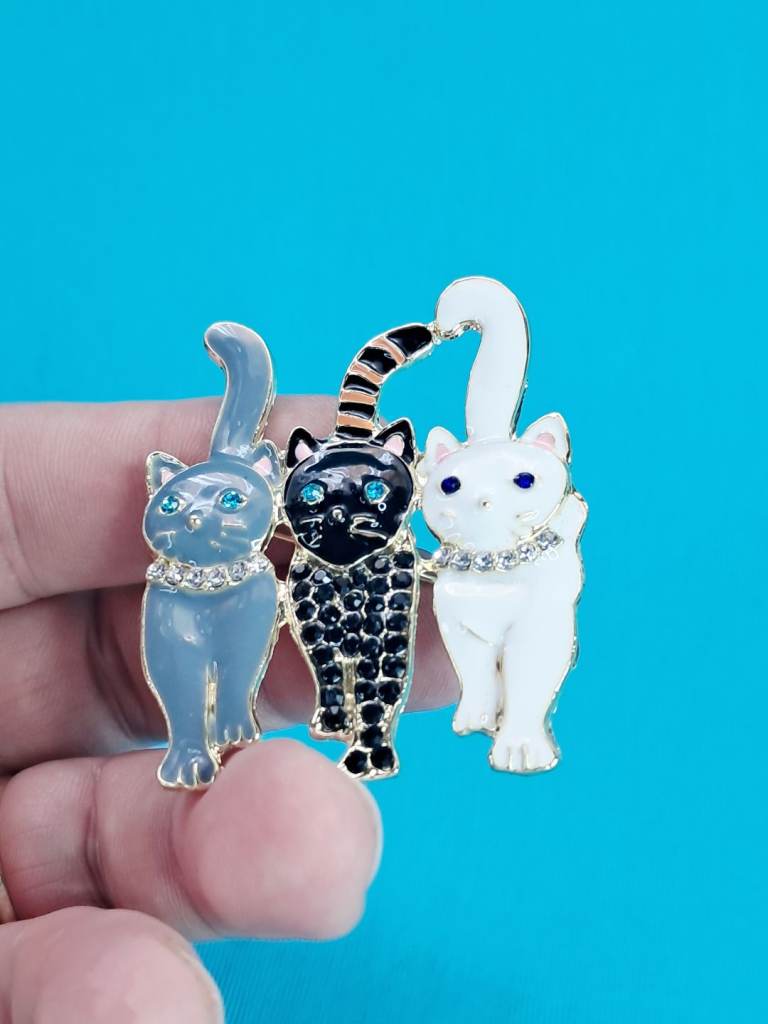 Beautiful enamel cat trio brooch featuring two cats and a kitten with rhinestone collar details. 