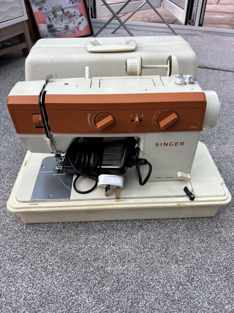 Singer 5502 Sewing Machine with Case – Good Condition