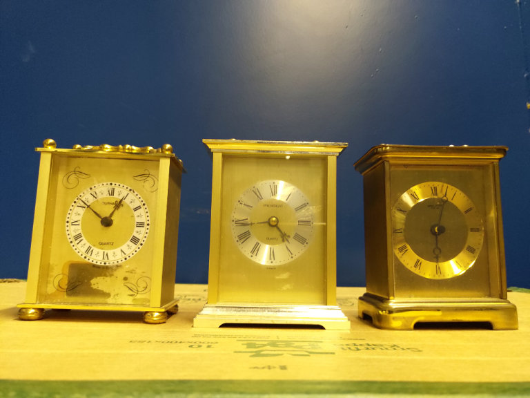 Three modern battery operated carriage clock