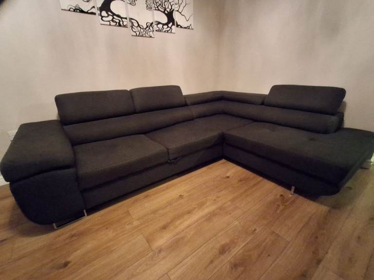Corner sofa bed with duvet storege