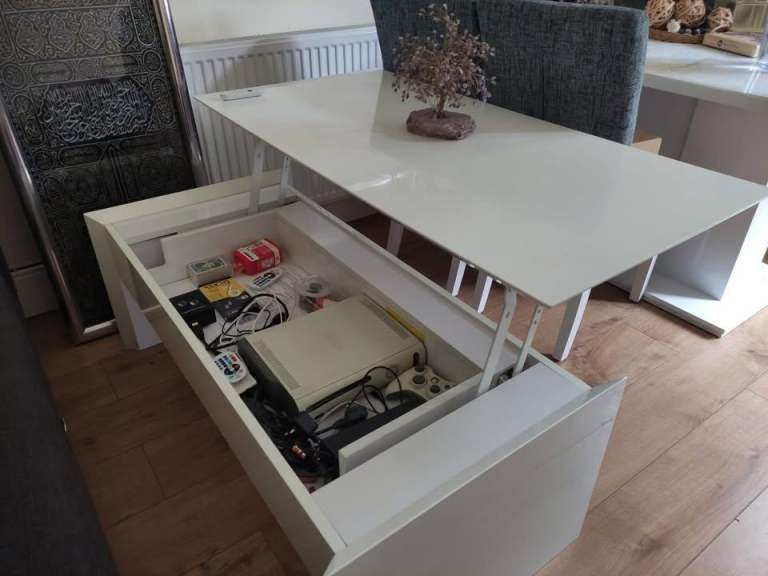 Gloss white coffee table cum dining table with storage