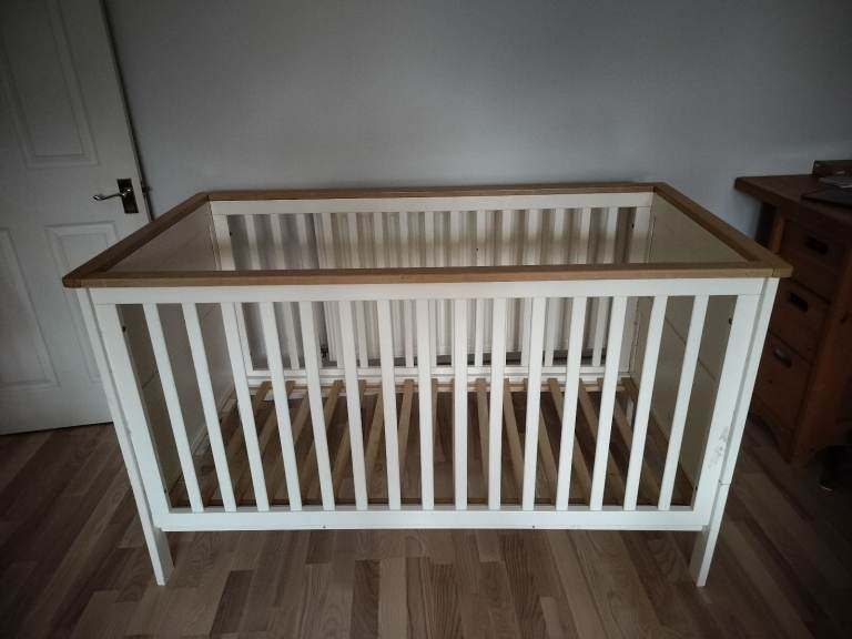Sturdy cot convertible to toddler bed (mattress not included)