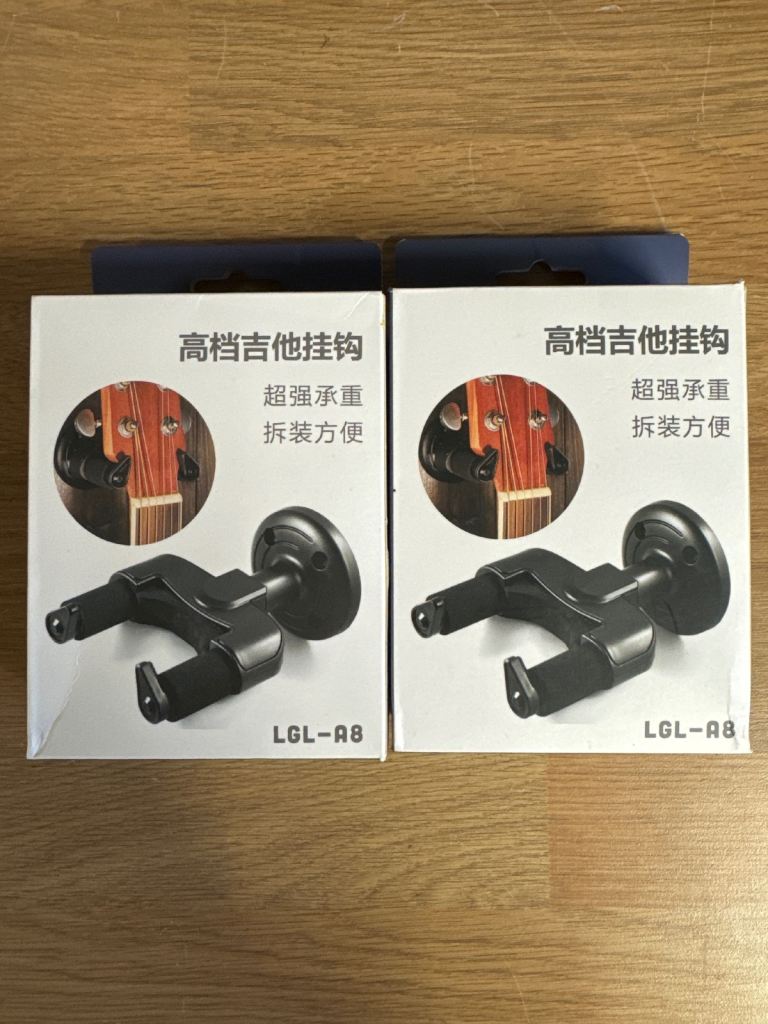 Two guitar wall mounts never been used. 