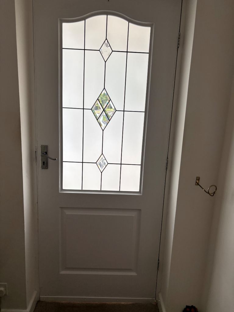 Exterior door with lock. Half frosted glass