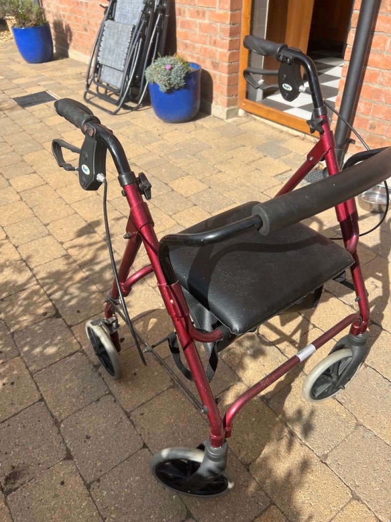 Red Mobility Walker with Seat – Good Condition