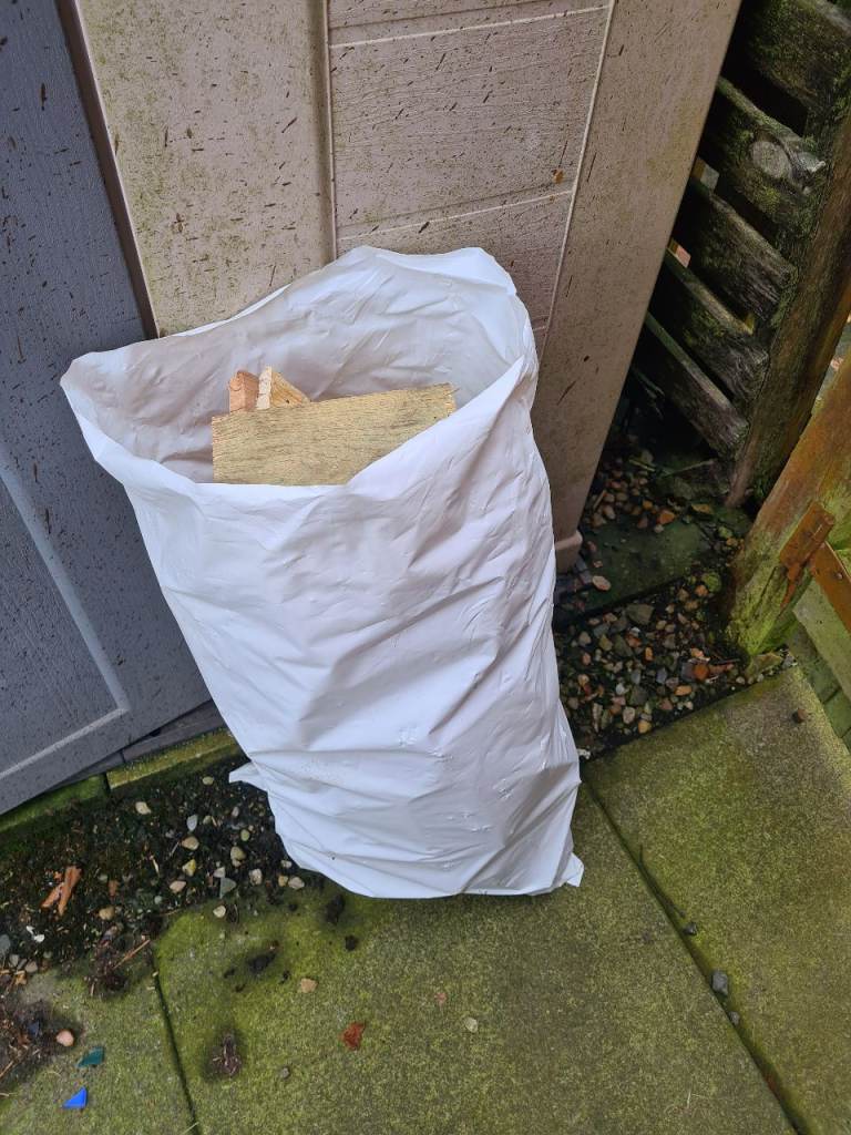 Bag of softwood firewood with nails dry