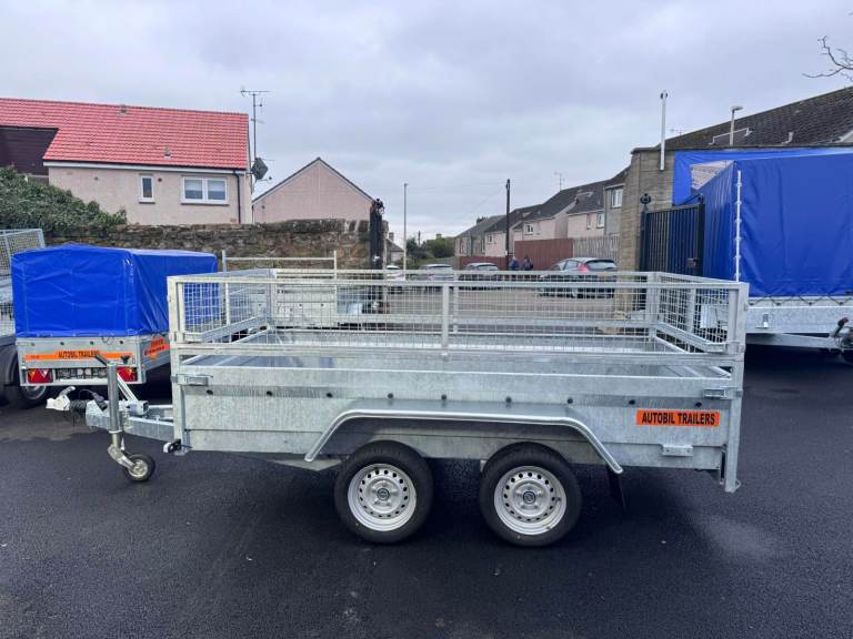 BRAND NEW 10FT X 5FT TWIN AXLE HEAVY DUTY TRAILER WITH 40CM MESH 2700KG BRAKED