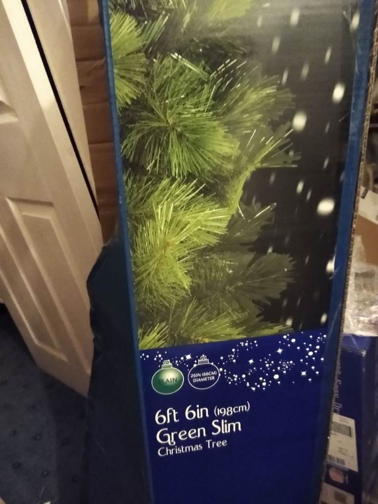 B&Q 6'6"Green Christmas tree with coloured lights (other decorations not included)