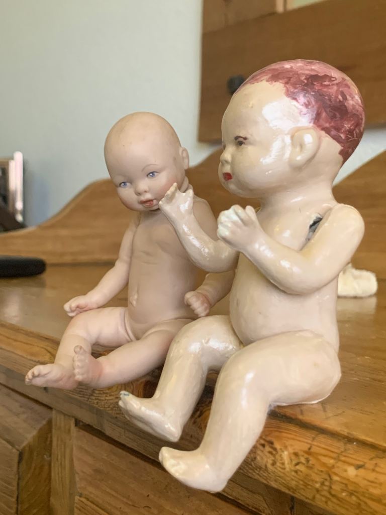 2 vintage dolls, 1 from 1985, 1 eatlier bisque doll