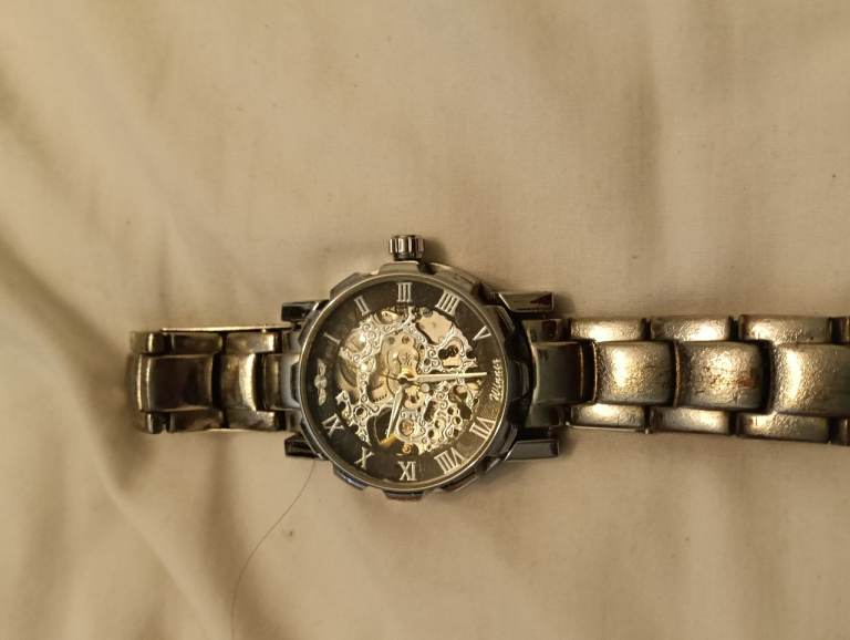 Silver Tone Mechanical Watch with Skeleton Dial – Good Condition