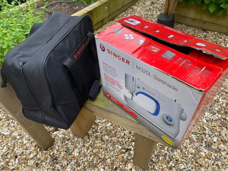Singer Serenade M320L electric sewing machine with case and large amount of sewing supplies