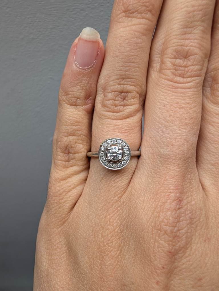 Platinum brilliant cut halo style cluster engagement ring