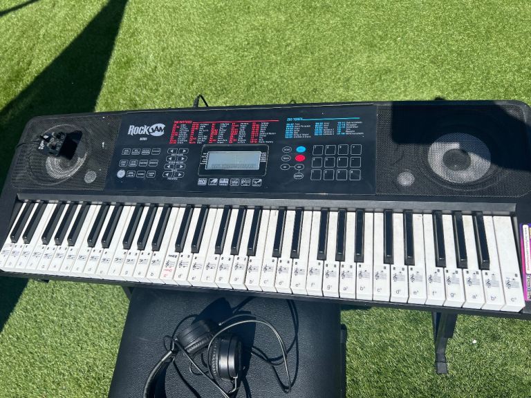 RockJam keyboard with stand, seat, pedal and headphones.