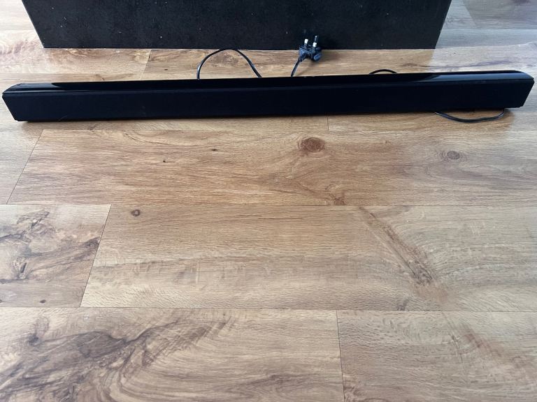 Sleek Black soundbar and woofer