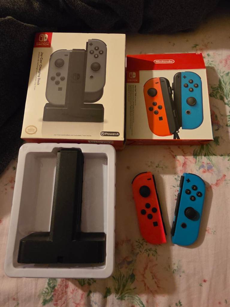 One set of Joy-Con switch controllers  / one Brand new charging dock 