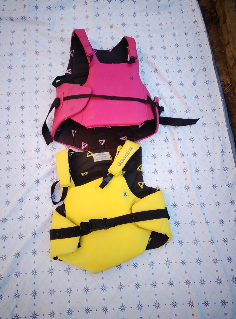 Two adult buoyancy aids