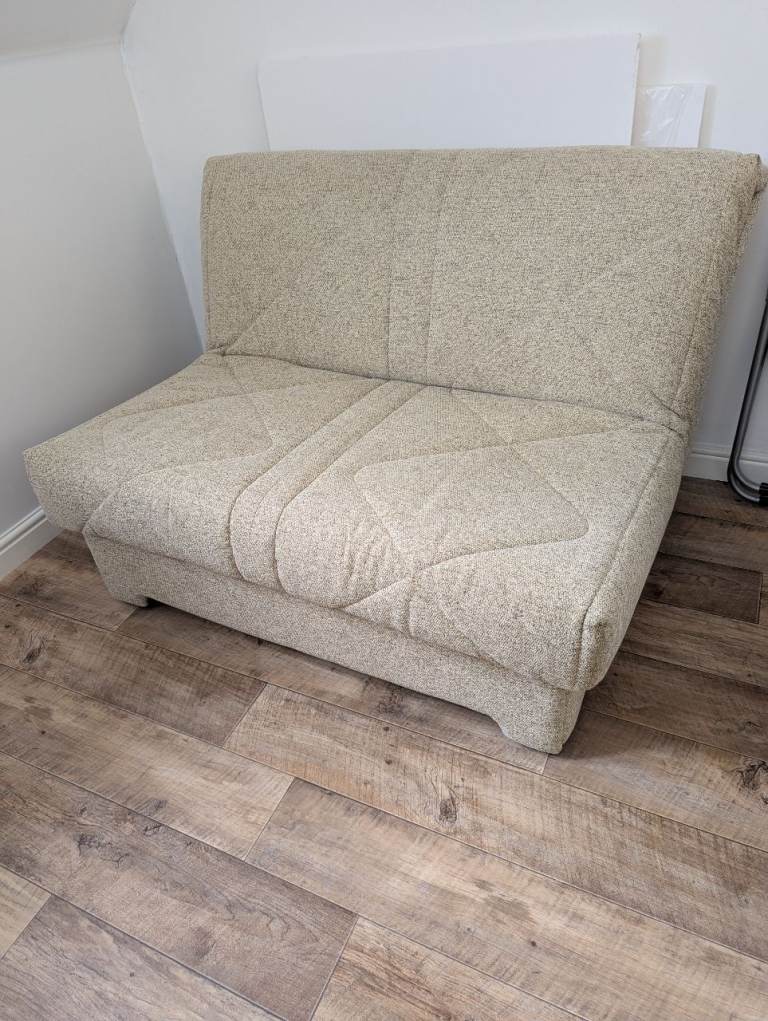 Compact Beige Sofa Bed – Good Condition, Space Saver