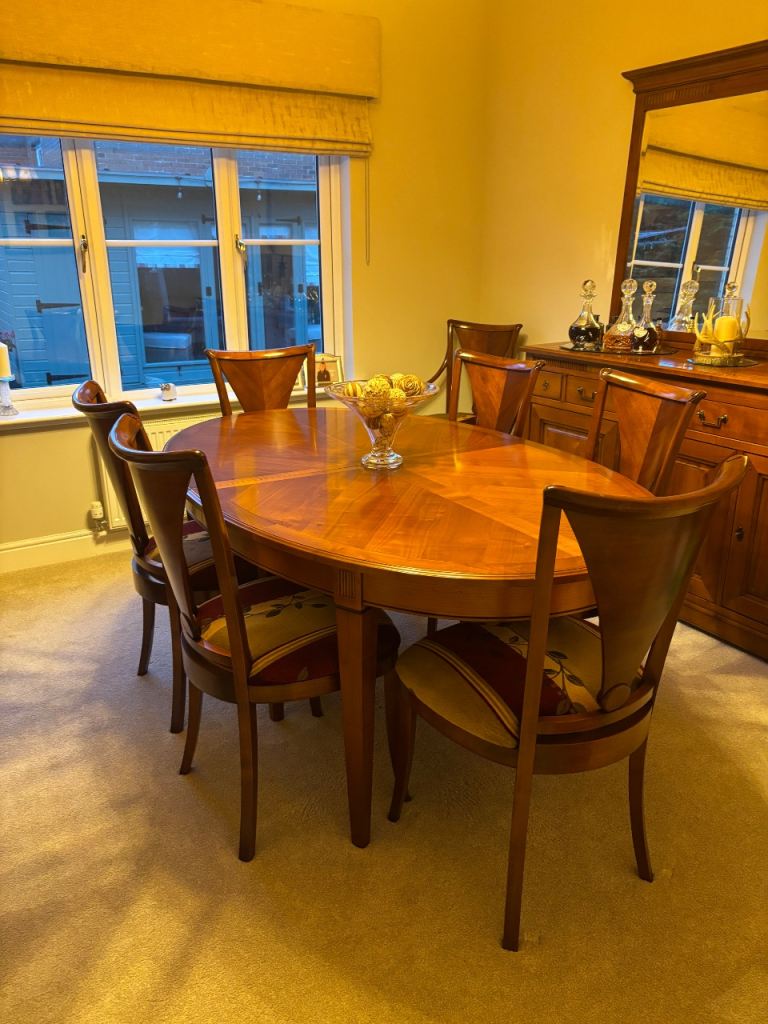 Solid dining room table with 8 chairs and matching dresser