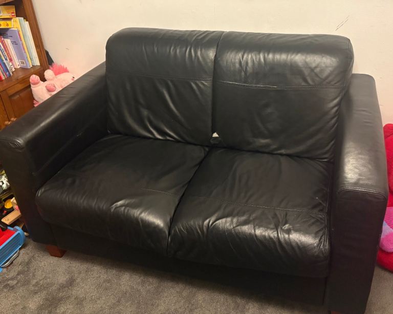 Black Leather Two-Seater Sofa – Fair Condition