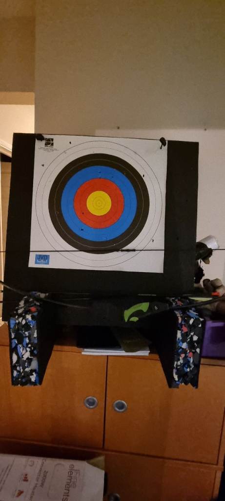Bow, arrows and target plus additional paper