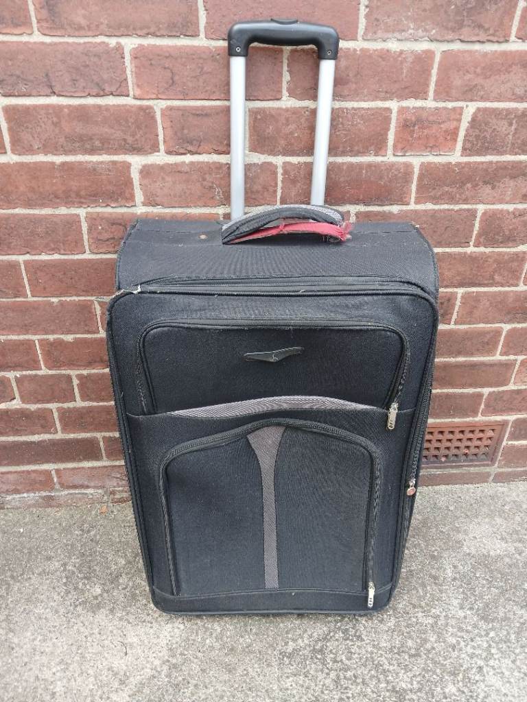 Large suitcase with wheels and handle 