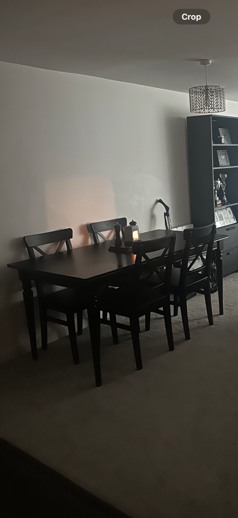 Black dining room table with chairs 