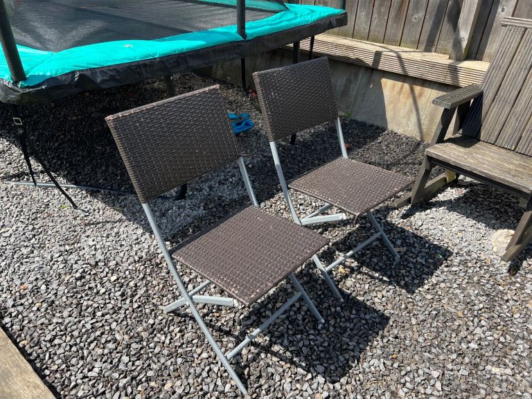 A pair of folding Rattan Chairs