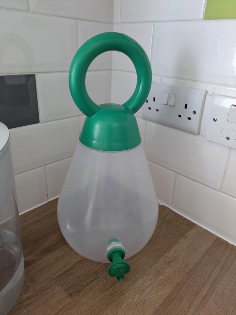 Green and Clear Plastic Watering Can 