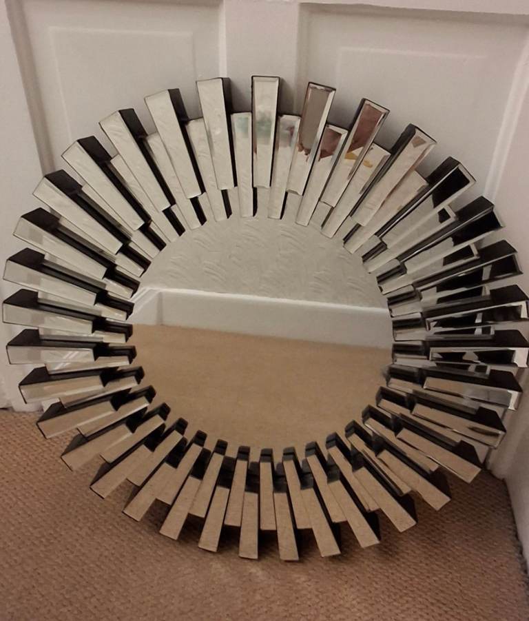 Lovely 60cm starburst wall mirror