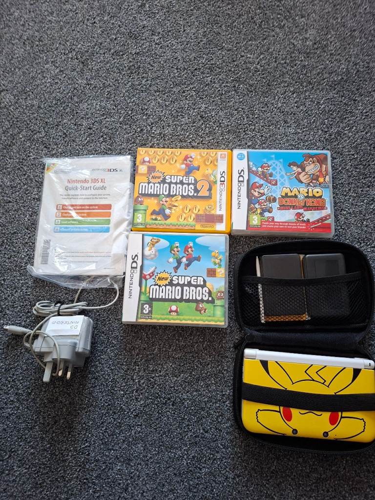 Nintendo DSi XL with Super Mario Games and Case
